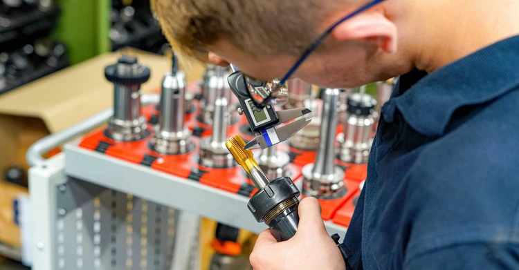 A worker checks the quality of an initial sample