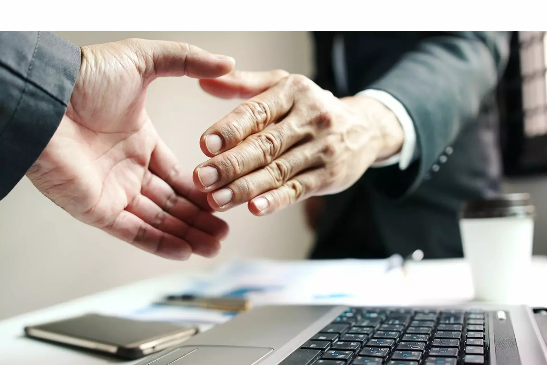 Close-up of two people shaking hands