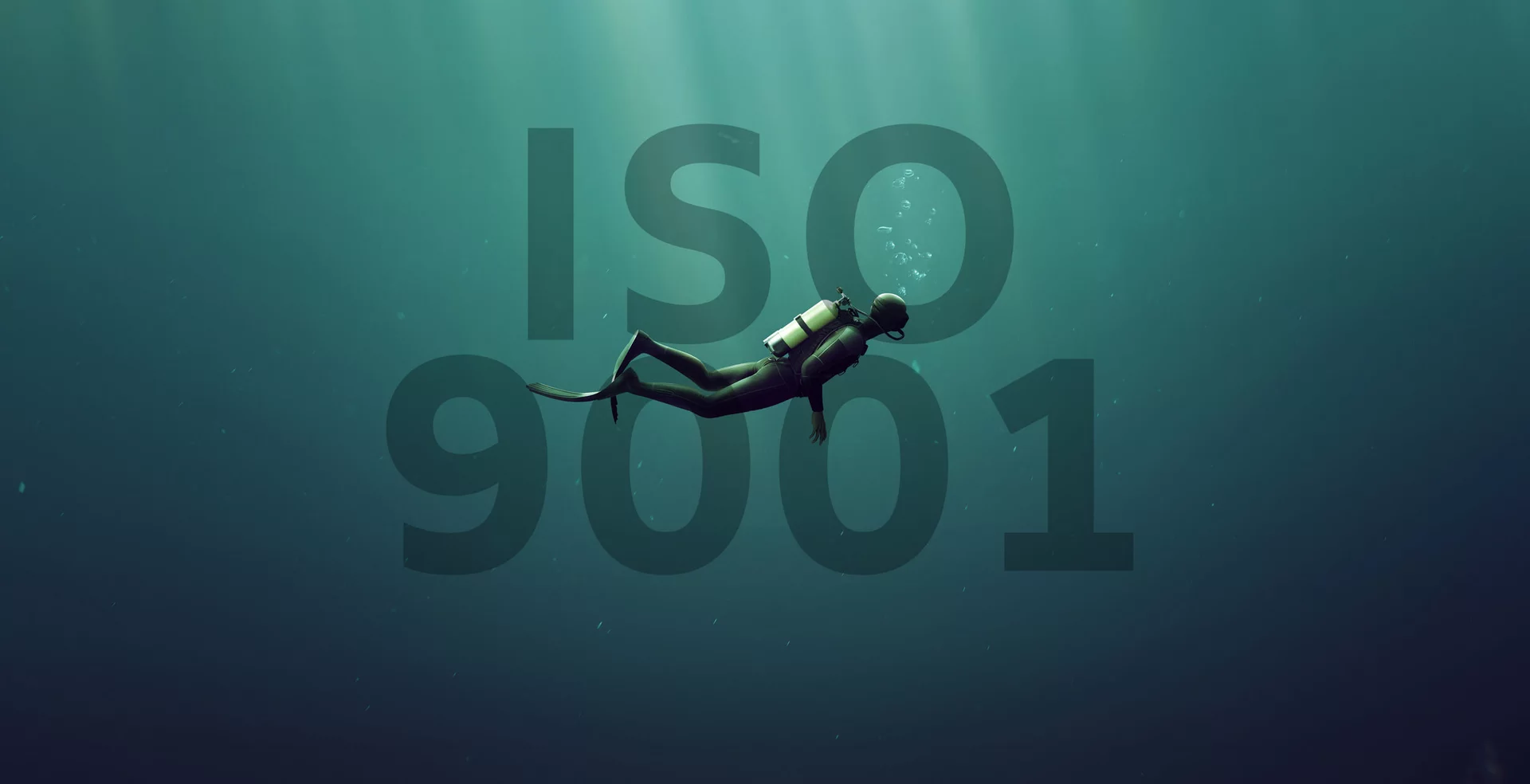 A diver in front of an ISO9001 lettering