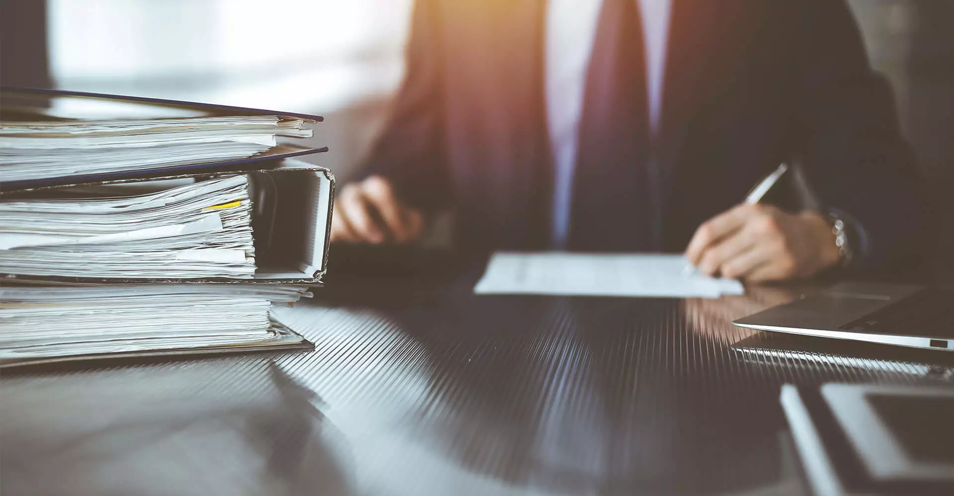 Man checks documents at his desk