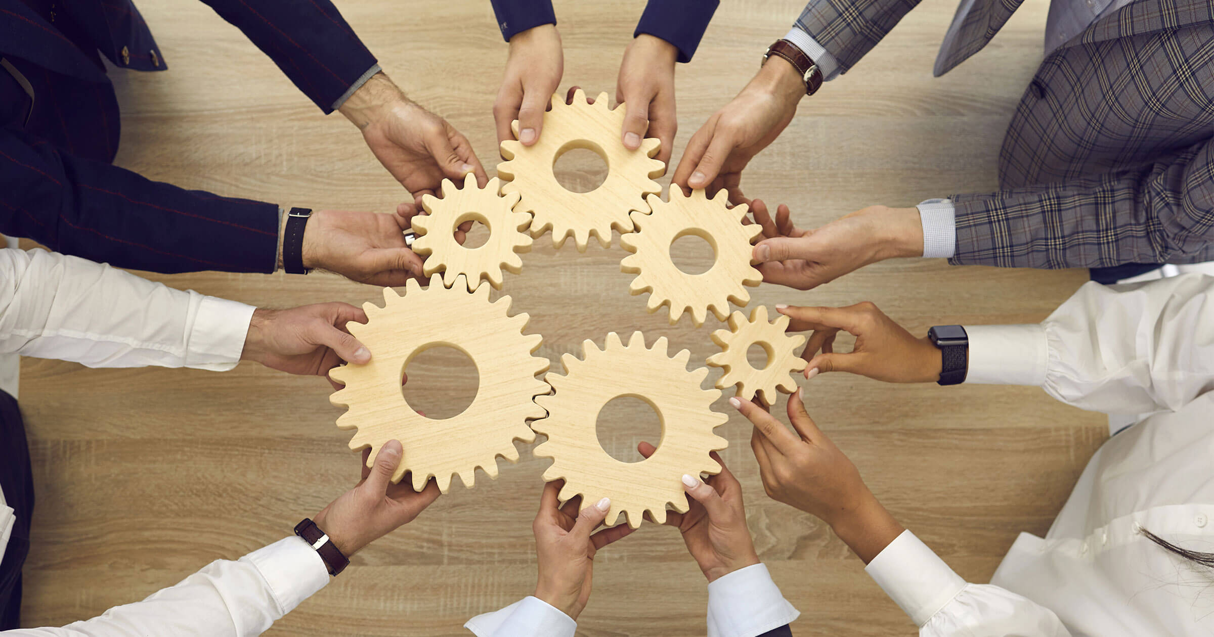 Management systems & the ecosystem for quality Hands hold multiple gears together